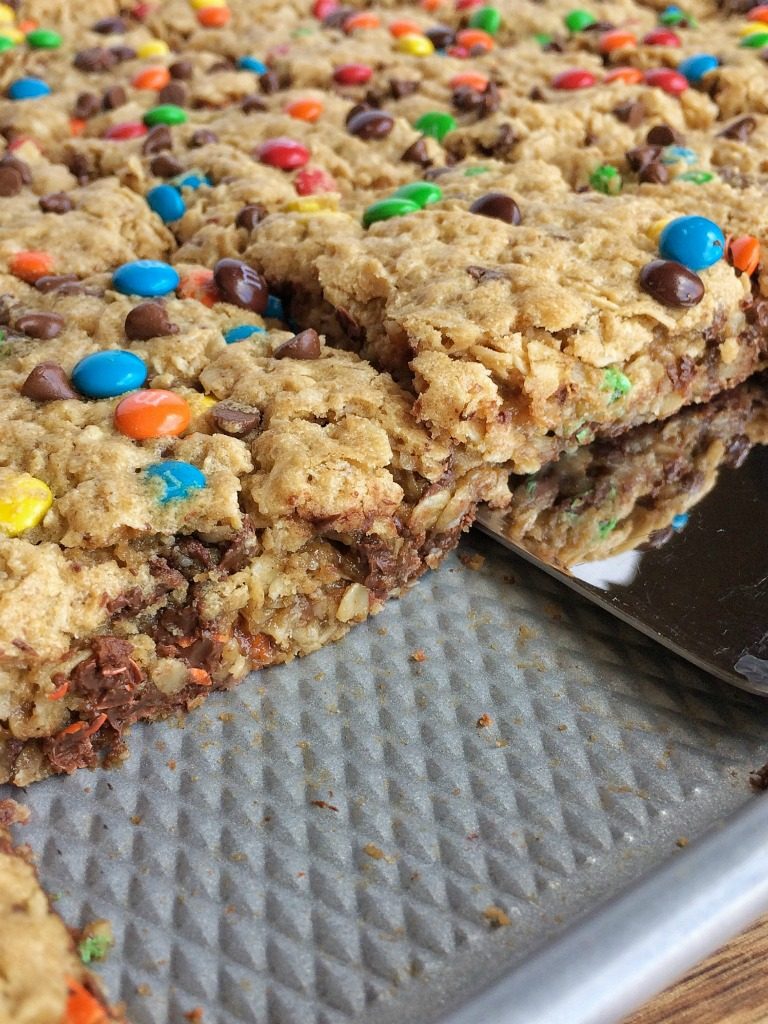 No Flour Monster Cookie Bars are loaded with oats, peanut butter, chocolate chips, and m&m's. They bake in a cookie sheet and make enough to feed a crowd. Plus, there is no flour in them!