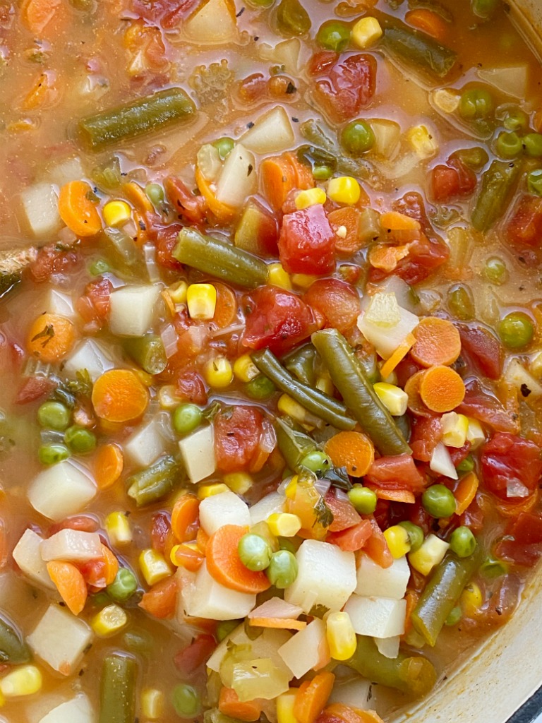 Vegetable Soup is packed with healthy and nutritious ingredients. Fresh vegetables in a perfectly seasoned broth base, and it cooks in one pot on the stove! Keeps for a week so leftovers are perfect for a healthy lunch.