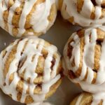 Cinnamon Roll Muffins require no yeast, only one bowl and they're ready in about 30 minutes! All the flavor, gooey cinnamon & sugar, and sweetness that you love about a cinnamon roll, but in an easy to make cinnamon roll muffin recipe.