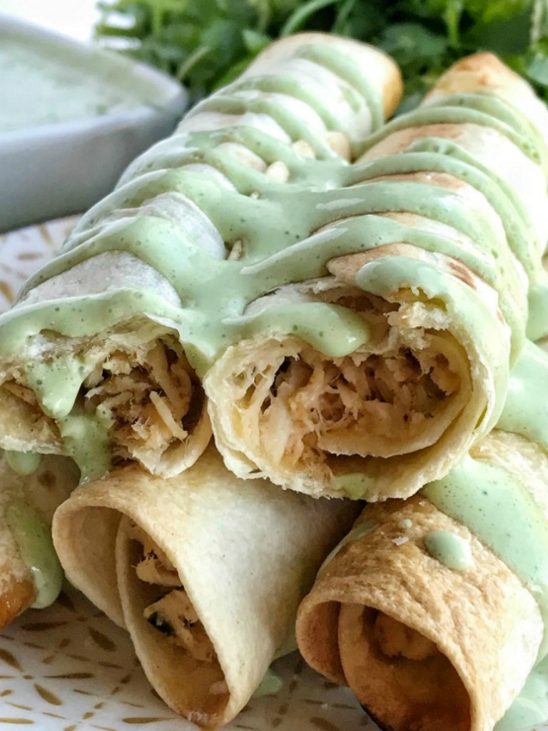 Baked Honey Lime Chicken Taquitos | A creamy, perfectly seasoned chicken mixture rolled up in a crispy flour tortilla and baked. No deep frying these taquitos! Baked Honey Lime Chicken Taquitos are a family favorite dinner. #dinnerrecipes #chickenrecipes #mexicanfood #dinner #taquitos #recipeoftheday