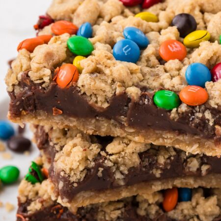 A stack of oatmeal fudge bars on a white plate.