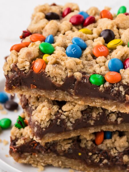 A stack of oatmeal fudge bars on a white plate.