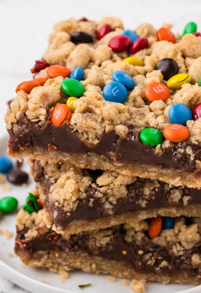 A stack of oatmeal fudge bars on a white plate.