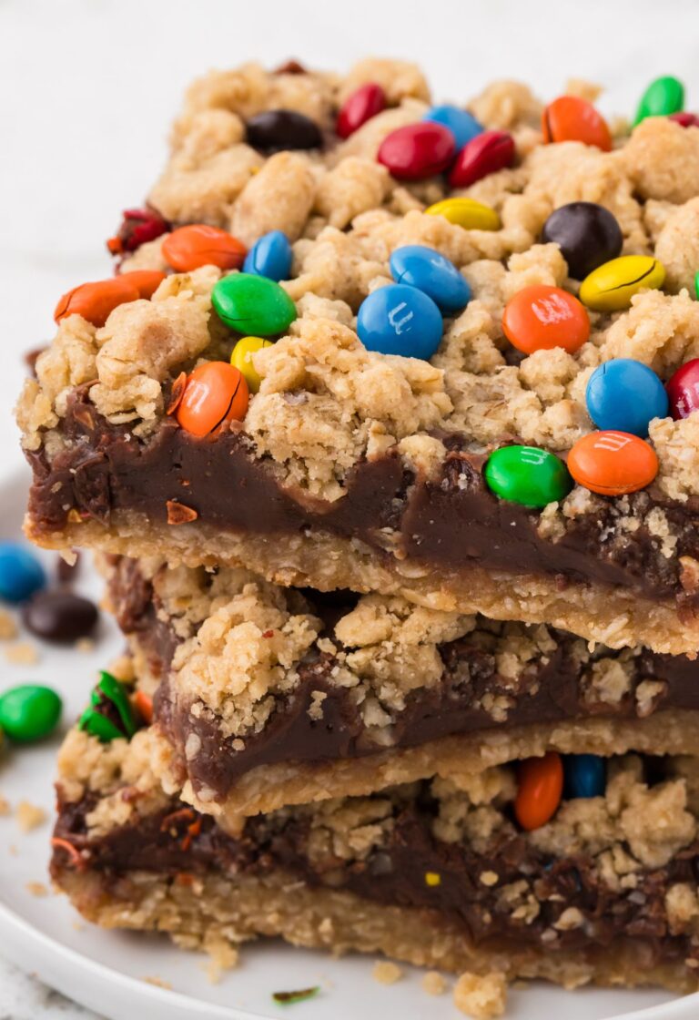 A stack of oatmeal fudge bars on a white plate.