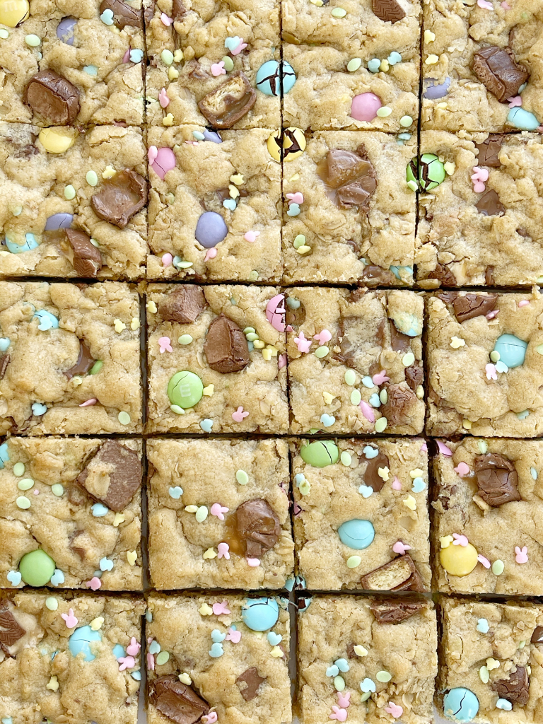 Easter surprise confetti cookie bar recipe with candy bar chunks, sprinkles, and m&m's.