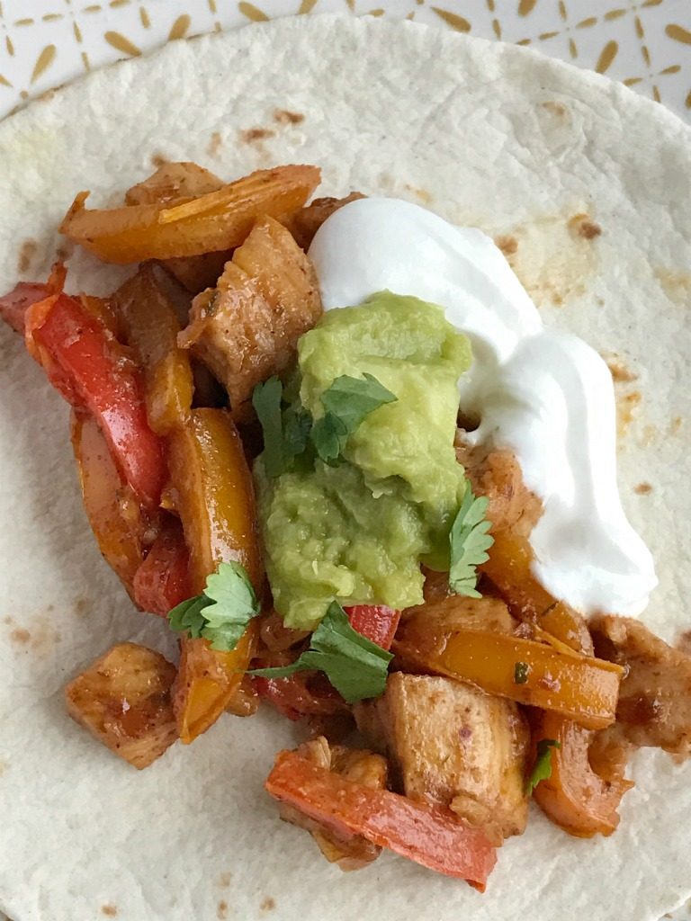 Chunks of chicken, onion, and sliced peppers cook in one pan on the stove top. Mix in some flavorful spices and ranch dressing for the best 30 minute meal. These skillet chicken ranch fajitas are perfect for a busy weeknight.
