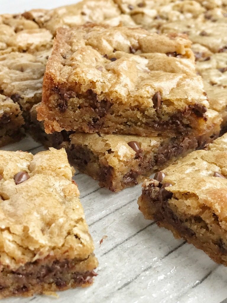 Chocolate chip cookie blondie bars are a chewy cookie bar loaded with chocolate chips and the best dessert! These bars bake in one pan and are so simple to make. They bake up perfectly sweet & chewy each time with crisp, buttery edges and a super soft middle. If you love chocolate chip cookies then you will want to make these.