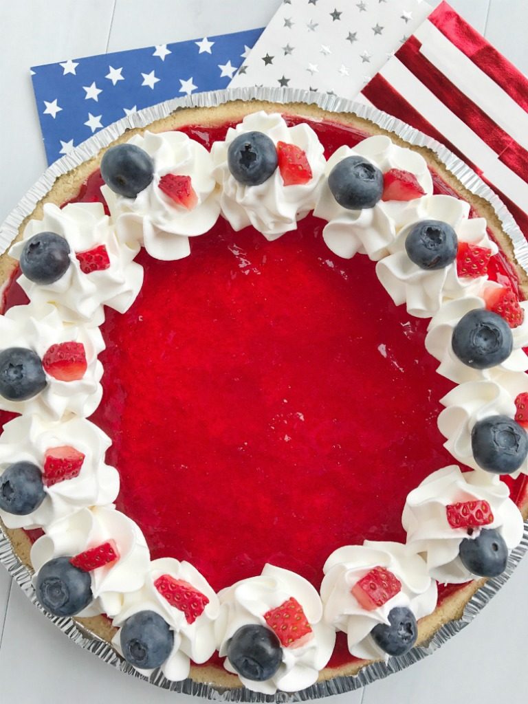 Celebrate the 4th of July with this delicious, totally festive, and easy patriotic Jello pie! 3 layers of red, white, and blue inside a store-bought prepared graham cracker crust. Top with additional Cool Whip and fresh fruit for a show stopper dessert at your own 4th of July picnic.