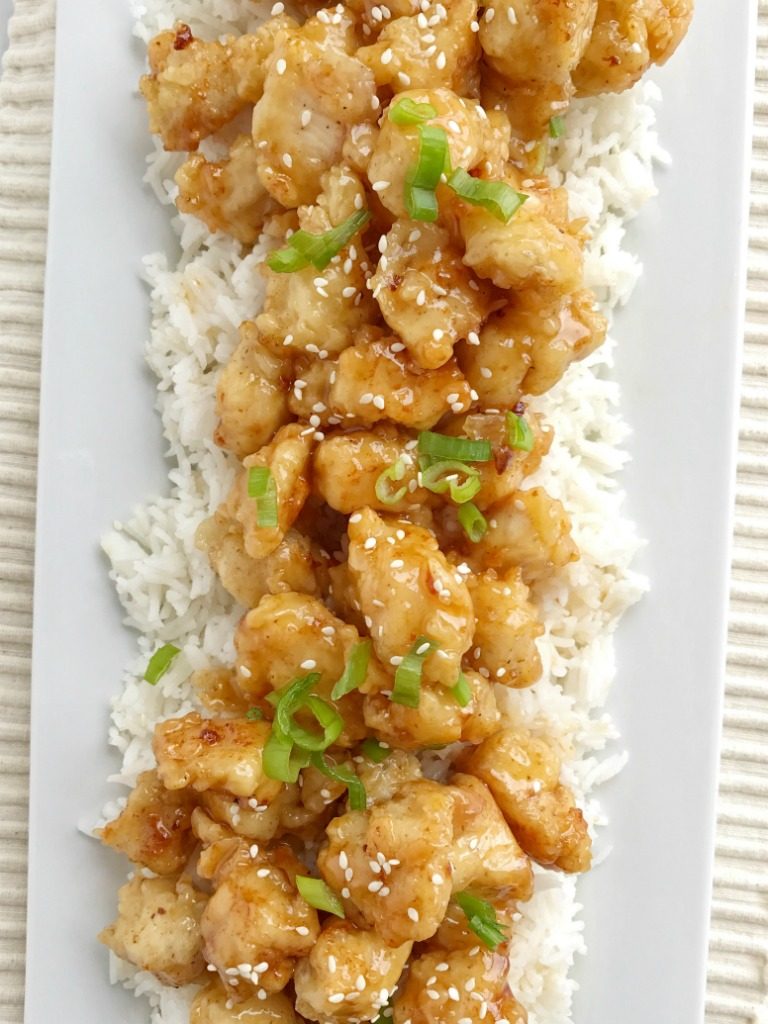 Crispy Asian honey chicken is tender chunks of chicken breaded with a crispy coating and pan fried. Whip up a quick & simple Asian honey sauce and drizzle over the crispy chicken. Serve with rice and you have a completely delicious dinner that will be better than any take-out.