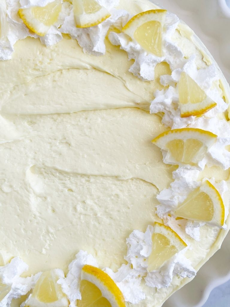 Lemon Cake recipe made easy with a cake mix and whipped pudding frosting. 