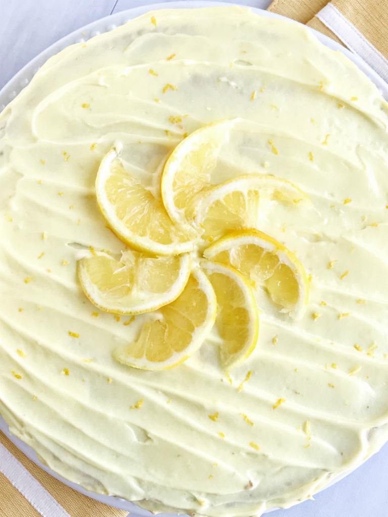 This easy lemon layered cake is for true lemon lovers! 3 layers of moist, sweet, lemon cake frosted with fluffy, light, lemon pudding frosting! Jazz up a boxed cake mix for the ultimate layered cake dessert that is easy and bursting with lemon flavor.
