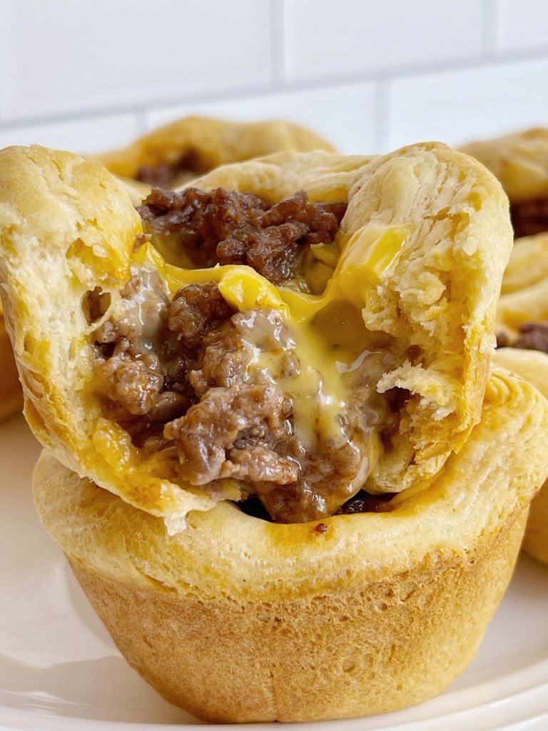 Cheeseburger biscuit cup recipe are made in a muffin pan with biscuits and ground beef cheeseburger mixture. 