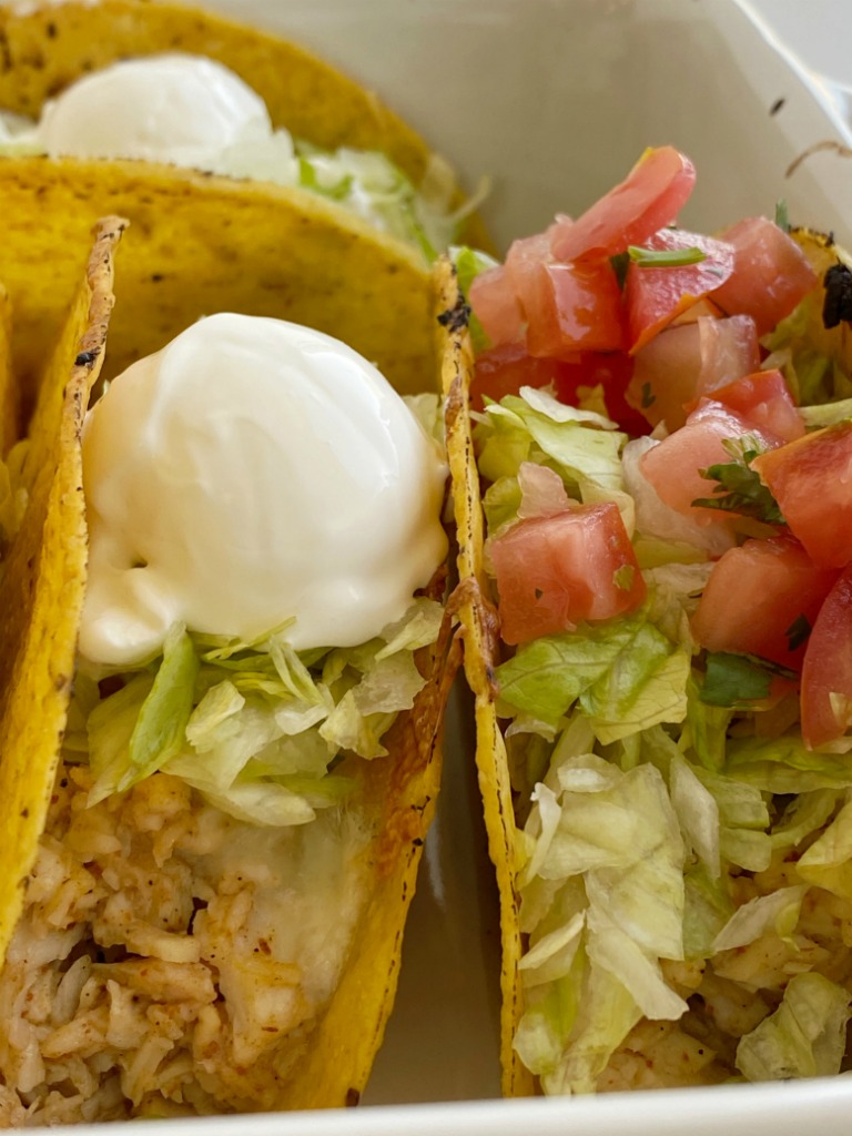 Baked Honey Lime Chicken Tacos are a quick 30 minute taco recipe that is perfect with rotisserie chicken or leftover chicken. Chicken tacos seasoned with honey, fresh lime juice, and spices cook in the oven for super crispy & crunchy tacos. 