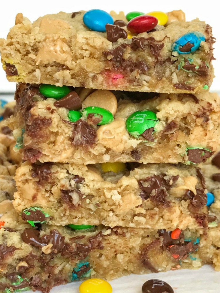 Monster cookie bars are a fun treat loaded with peanut butter, oats, chocolate chips, peanut butter chips, and mini m&m's. They bake up perfectly soft, chewy, and thick. A fun treat to make with the kids or great for back-to-school lunches or after school treat. 