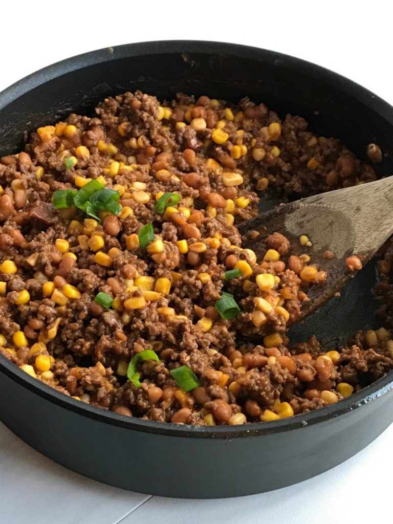 20 minutes and one skillet pan is all you need for these sweet & smoky bbq beef ranchero tacos. Baked beans, corn, and some Mexican spices come together for one delicious taco dinner that is sure to be become a family favorite.  