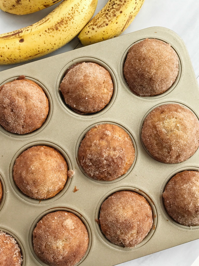 Cinnamon banana bread muffins taste like banana bread in muffin form! They are perfectly light and moist, loaded with banana flavor, and bake up beautifully each time. Topped in butter and a sweet cinnamon crumble. 