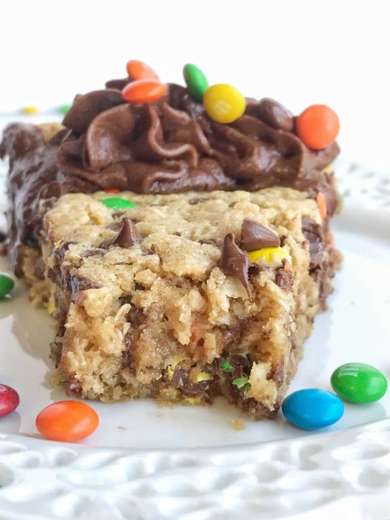 A giant monster cookie that's so thick, soft-baked, chewy, and loaded with all the monster cookie favorites. Oats, chocolate, peanut butter, and m&m's. This giant monster cookie makes for a great first day of school tradition too. Kids will love it as a fun after school snack to celebrate their first day. 