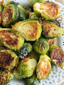Oven roasted parmesan Brussel sprouts are a quick & easy 20 minute side dish that is healthy and delicious. Only a few simple ingredients to the best Brussel sprouts that are bursting with flavor!