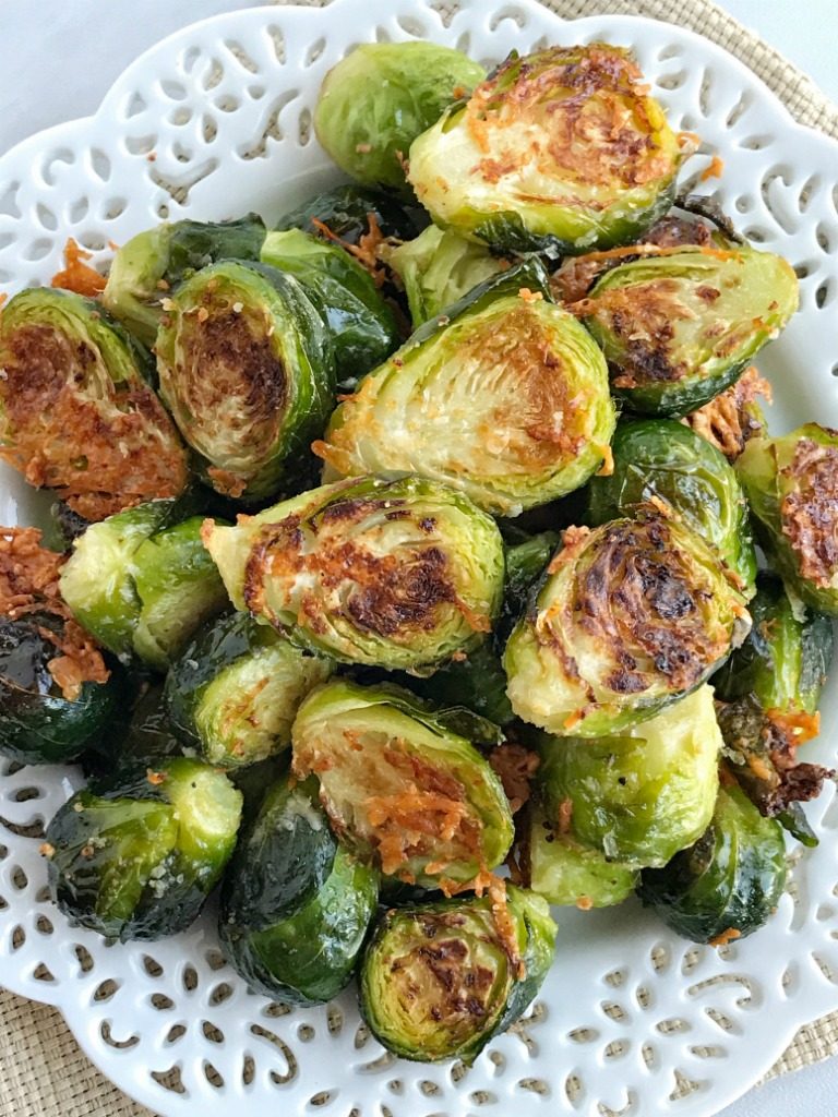 Oven roasted parmesan Brussel sprouts are a quick & easy 20 minute side dish that is healthy and delicious. Only a few simple ingredients to the best Brussel sprouts that are bursting with flavor!