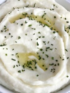 These are perfect cream cheese mashed potatoes. Only a few simple ingredients for creamy, smooth, and mashed potatoes that are full of flavor. A great side dish for Thanksgiving, dinner, or any special Holiday dinner | togetherasfamily.com #thanksgiving #recipe #mashedpotatoes