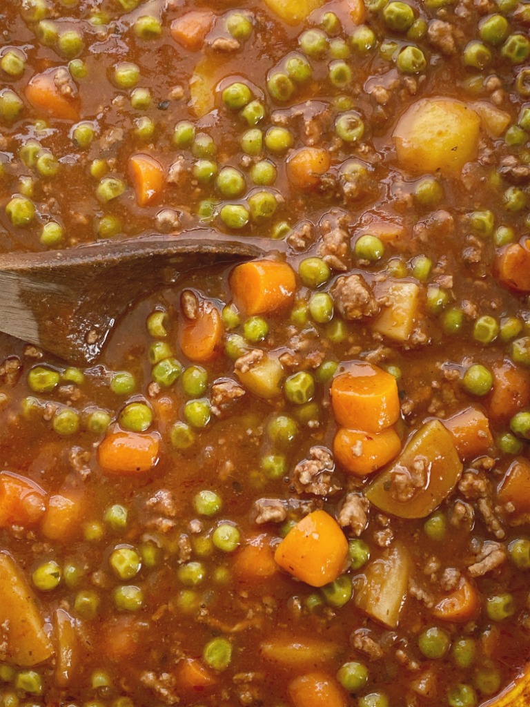 Ground Beef Stew is made in the slow cooker and it will make your house smell amazing! Kid friendly ground beef, potatoes, carrots in a richly seasoned tomato beef broth base. Serve with rolls or bread to soak up all the goodness. 