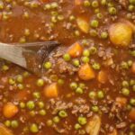Ground Beef Stew is made in the slow cooker and it will make your house smell amazing! Kid friendly ground beef, potatoes, carrots in a richly seasoned tomato beef broth base. Serve with rolls or bread to soak up all the goodness.