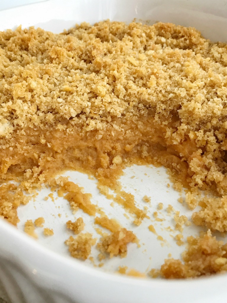 Buttery cracker sweet potato casserole can be on the dinner table in just 30 minutes! No boiling & peeling sweet potatoes. Sweet and creamy sweet potatoes topped with crunchy buttery cracker crumbs. This is such a fun twist to the classic casserole but so much easier. The perfect Thanksgiving side dish | www.togetherasfamily.com #sweetpotatocasserole #casserolerecipes #thanksgivingrecipes