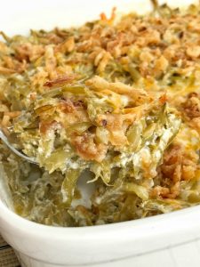 Look no further for the best creamy cheesy green bean casserole! Only a few simple ingredients, canned green beans, and a few minutes prep is all you need for the best green bean casserole. No creamed soup and no mushrooms. This recipe is a must have side dish for Thanksgiving dinner | www.togetherasfamily.com #greenbeancasserole #sidedish #thanksgivingdinner #thanksgiving #casserole #greenbeans