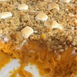 Creamy sweet potatoes topped with a loaded & crumbly topping! Loaded sweet potato casserole has a base of sweet potato topped with a crumble of marshmallows, pecans, and coconut! Everyone's favorite classic sweet potato casserole toppings all in one dish | www.togetherasfamily.com #thanksgivingrecipes #thanksgivingfood #sweetpotatocasserole #sweetpotatocasserolerecipe #casserolerecipes