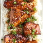 4 ingredients are all you need for this super easy & quick dinner recipe! Slow cooker Asian sesame chicken is a family pleasing meal that is loaded with lots of flavor and tender chicken. Serve over hot cooked rice and a side of veggies for an easy dinner that will be gobbled up | www.togetherasfamily.com #crockpotrecipes #slowcookerrecipes #chicken #chickenrecipes #dinner #dinnerrecipes