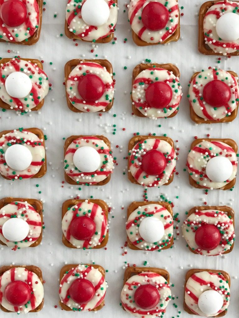 Peppermint Bark Pretzel Bites | white chocolate m&m candy. Perfect for Christmas cookie plates or just a fun Holiday treat | www.togetherasfamily.com #christmascookies #peppermintrecipes #peppermintdesserts #christmasdesserts #candycanerecipes