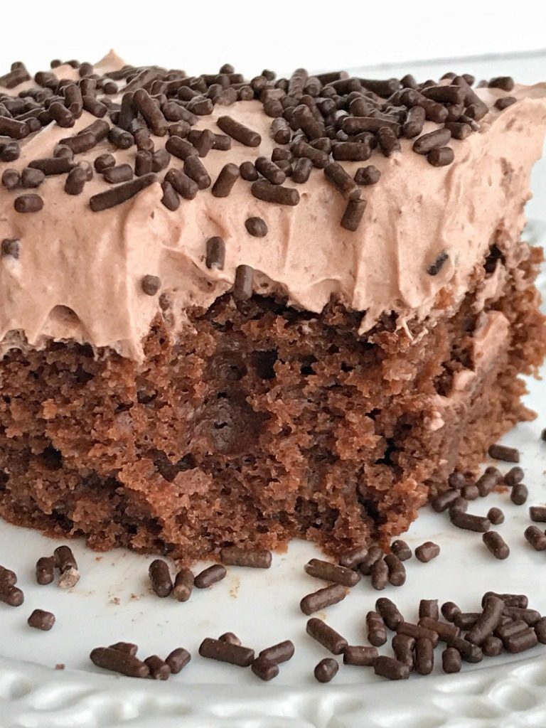 Skinny Chocolate Cake | This skinny chocolate cake is made with a chocolate cake mix, chocolate Greek yogurt and topped with a light & fluffy chocolate whipped frosting! You won't believe that each serving is only 200 calories | Together as Family #healthyrecipes #recipeoftheday #chocolaterecipes #dessertrecipes #recipe #dessert #chocolate #valentinesdayrecipes