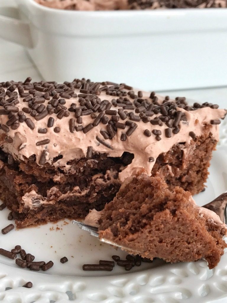 Skinny Chocolate Cake | This skinny chocolate cake is made with a chocolate cake mix, chocolate Greek yogurt and topped with a light & fluffy chocolate whipped frosting! You won't believe that each serving is only 200 calories | Together as Family #healthyrecipes #recipeoftheday #chocolaterecipes #dessertrecipes #recipe #dessert #chocolate #valentinesdayrecipes