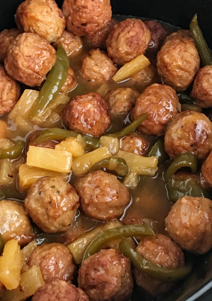 Slow Cooker Sweet & Sour Meatballs | Slow cooker sweet sour meatballs are an easy & simple dinner that even the kids will gobble up. Prepared frozen meatballs combine with an easy homemade sweet & sour sauce. Serve over rice for a delicious Asian-inspired dinner | Together as Family #dinnerrecipes #easydinnerrecipes #slowcooker #crockpotrecipes