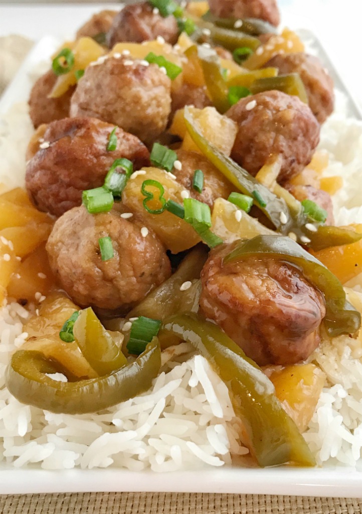 Slow Cooker Sweet & Sour Meatballs | Slow cooker sweet sour meatballs are an easy & simple dinner that even the kids will gobble up. Prepared frozen meatballs combine with an easy homemade sweet & sour sauce. Serve over rice for a delicious Asian-inspired dinner | Together as Family #dinnerrecipes #easydinnerrecipes #slowcooker #crockpotrecipes