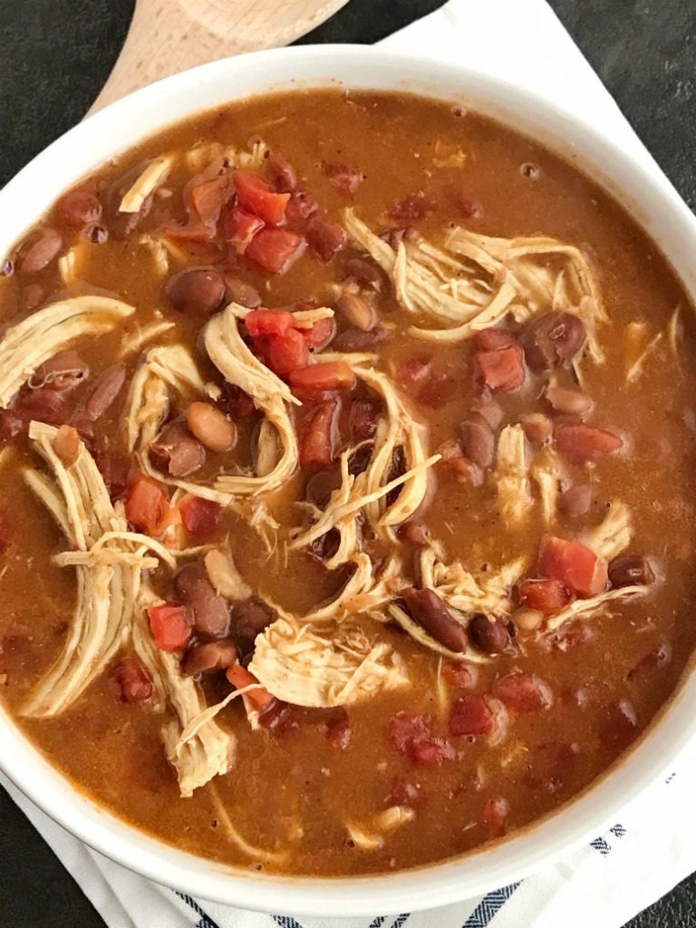 Chicken Tortilla Soup Recipe | The best 5 ingredient chicken tortilla soup only takes 20 minutes to make! One pot is all you need for this delicious and creamy tortilla soup. Combine 5 ingredients + some spices and let it simmer on the stove top. Top with cheese, avocado, chips, and sour cream.