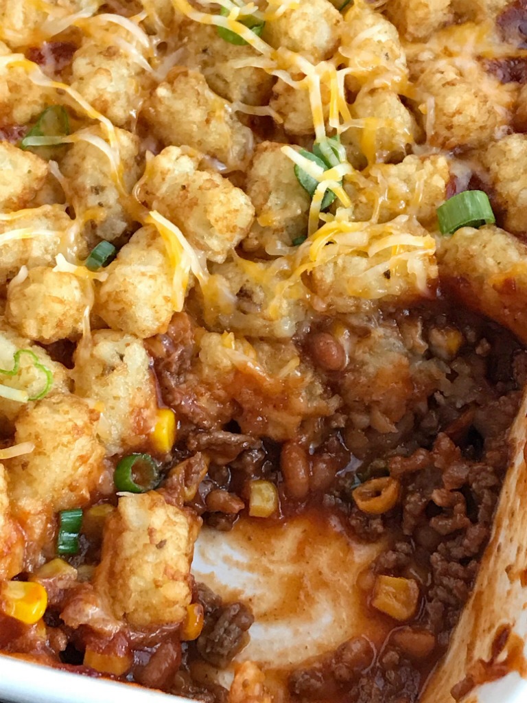 BBQ Beef Sloppy Joe Tater Tot Casserole | Sloppy joe tater tot casserole is a family favorite dinner. Seasoned bbq ground beef is topped with cheese and mini tater tots that are cooked to crispy perfection. Kids love this sweet bbq tater tot casserole | Together as Family #casserolerecipes #easydinnerrecipes #groundbeefrecipes