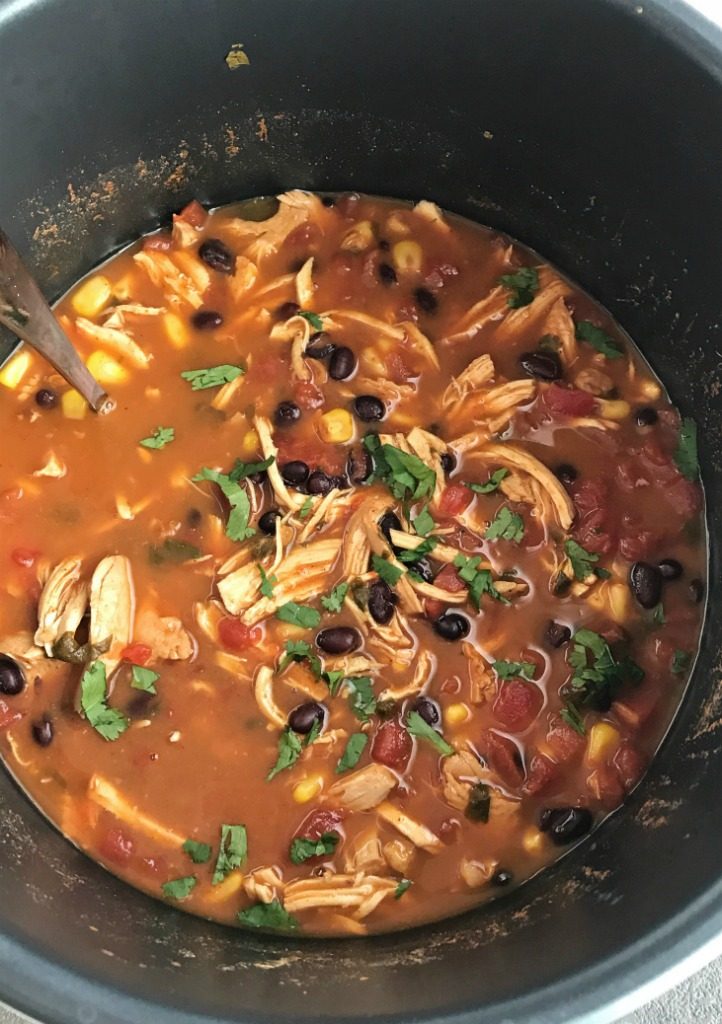 Instant Pot Chicken Tortilla Soup | Healthy chicken tortilla soup made right in an instant pot! It's practically dump n' go and loaded with tender chicken, black beans, tomato, corn, and simmers in the pressure cooker, instant pot, or express cooker. Top with tortilla strips, cheese, and avocado for a healthy and easy dinner | Together as Family #instantpotrecipes #instantpot #pressurecookerrecipes #souprecipes #easydinnerrecipes