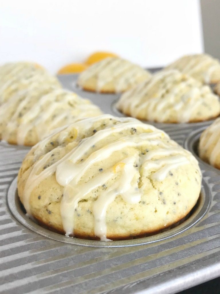 Coconut Lemon Poppyseed Muffins | Perfect coconut lemon poppyseed muffins are a must make for Easter and springtime. Coconut and lemon combine in a soft & moist poppyseed muffin with a lemon glaze on top. These muffins are filled with coconut oil, coconut extract, fresh lemon zest & juice, and poppyseeds #muffins #muffinrecipes