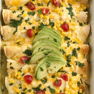 Green Chili Corn Enchiladas | Enchilada Recipes | Chicken Recipes | Mexican Food | Easy Dinner Recipes | Green chili chicken corn enchiladas are an easy family dinner that can be on the table in almost 30 minutes! Use leftover chicken or a rotisserie chicken, canned corn, cheese, and green chili enchilada sauce. Easy and simple ingredients for a delicious dinner recipe #dinnerrecipes #easyrecipes #enchiladarecipes