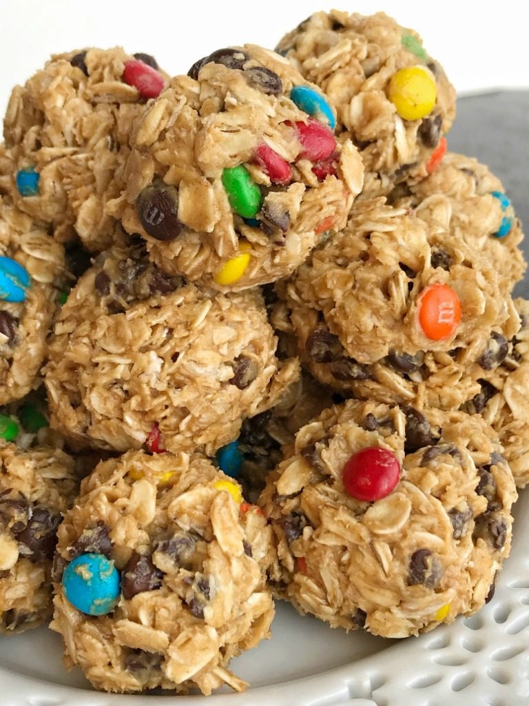 Monster Cookie Energy Balls | Energy Bites | Oatmeal Energy Balls | Healthy Snacks | Monster cookie energy balls are a great afternoon energy boost or perfect for an after school snack. Hearty oats, chocolate chips, peanut butter, honey, and m&m's make these energy balls so delicious and fun. They only take minutes to make and kids can even do it themselves!