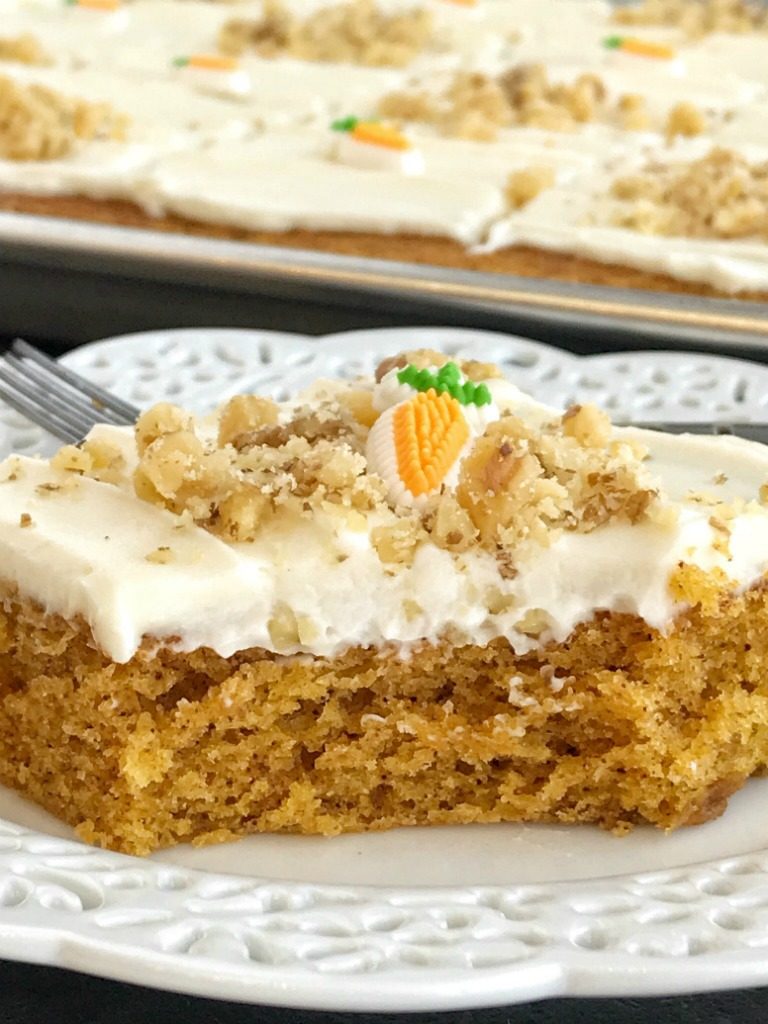 Sheet Pan Carrot Cake Bars | Carrot Cake | Easter Recipes | Easter Dessert | Cake | Sheet Pan | One Pan | Sheet pan carrot cake bars are made with a surprise ingredient that makes them so moist, soft, and easy to make - carrot baby food! No shredding and peeling carrots needed for these delicious carrot cake bars that feed a crowd. Top them with a whipped cream cheese frosting and garnish with chopped walnuts for the best carrot cake dessert.