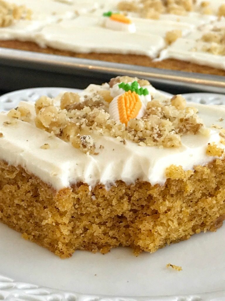 Sheet Pan Carrot Cake Bars | Carrot Cake | Easter Recipes | Easter Dessert | Cake | Sheet Pan | One Pan | Sheet pan carrot cake bars are made with a surprise ingredient that makes them so moist, soft, and easy to make - carrot baby food! No shredding and peeling carrots needed for these delicious carrot cake bars that feed a crowd. Top them with a whipped cream cheese frosting and garnish with chopped walnuts for the best carrot cake dessert. 