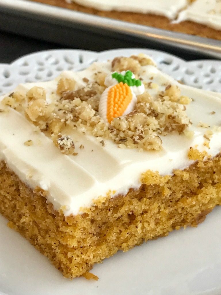 Sheet Pan Carrot Cake Bars | Carrot Cake | Easter Recipes | Easter Dessert | Cake | Sheet Pan | One Pan | Sheet pan carrot cake bars are made with a surprise ingredient that makes them so moist, soft, and easy to make - carrot baby food! No shredding and peeling carrots needed for these delicious carrot cake bars that feed a crowd. Top them with a whipped cream cheese frosting and garnish with chopped walnuts for the best carrot cake dessert. 