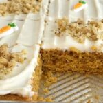 Sheet Pan Carrot Cake Bars | Carrot Cake | Easter Recipes | Easter Dessert | Cake | Sheet Pan | One Pan | Sheet pan carrot cake bars are made with a surprise ingredient that makes them so moist, soft, and easy to make - carrot baby food! No shredding and peeling carrots needed for these delicious carrot cake bars that feed a crowd. Top them with a whipped cream cheese frosting and garnish with chopped walnuts for the best carrot cake dessert.