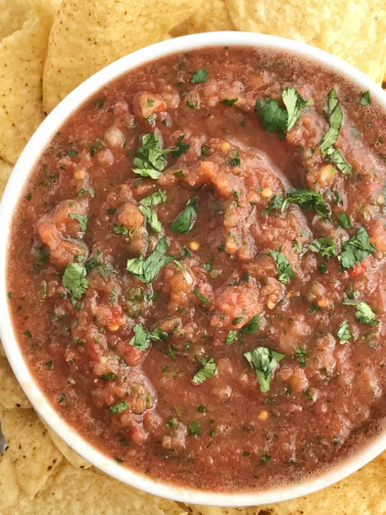 Homemade Blender Salsa | Homemade Salsa | Appetizer | Mexican Food | 10 Minutes | Quick and Easy | This 10 minute homemade blender salsa is so simple & yummy that you will never buy salsa again! Canned whole tomatoes, cilantro, onion, jalapeno, garlic, lime, and seasonings combine for an easy homemade salsa that's made in the blender in only 10 minutes. Serve with chips for an appetizer/snack or use in any recipe that calls for salsa. #easyrecipes #homemade 