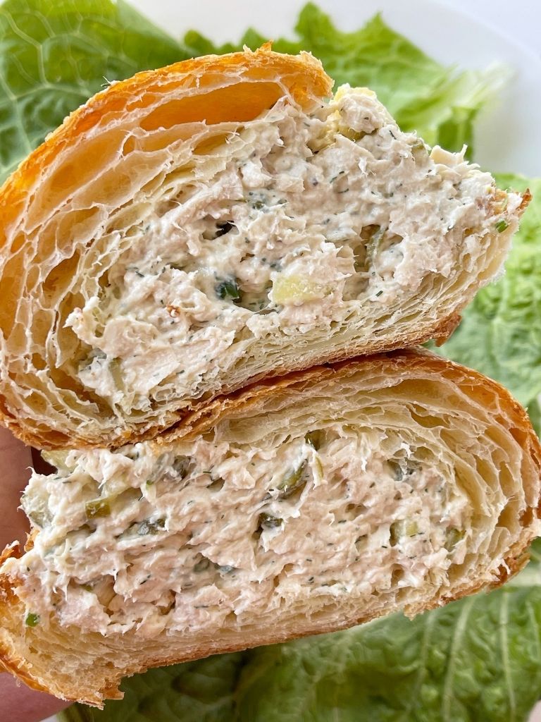 Dill pickle chicken salad recipe inside a croissant. 