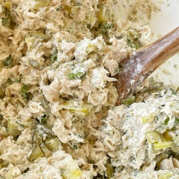 Recipe for dill pickle chicken salad. A chicken salad full of chicken, dill pickles, and green onion with a cream cheese dill pickle dressing.