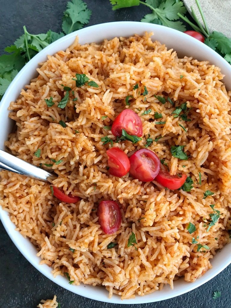 Instant Pot Mexican Rice | Instant Pot Mexican rice is the perfect side dish to any Mexican food! Perfect for burrito bowls, side dish, inside burritos, or on top of nachos! Fluffy and flavorful Mexican rice is made in the Instant Pot with only a few simple ingredients. #instantpot #instantpotrecipes #mexicanrice #mexicanfood #mexicanfoodrecipes
