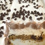 Chocolate Chip Cookie Layered Pudding Dessert | Pudding Dessert | Chocolate Chip Cookie | No Bake Desserts | Layers of chocolate chip cookies, cream cheese, chocolate pudding, and Cool Whip. Perfect no bake dessert for summer bbq's and get togethers. #easydessertrecipes #nobakedesserts #dessert
